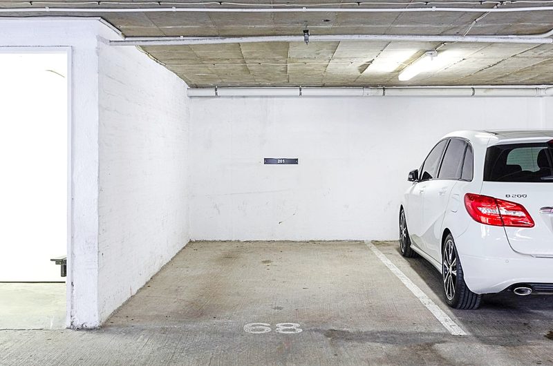 A numbered parking bay in the garage at 220 Loop Street