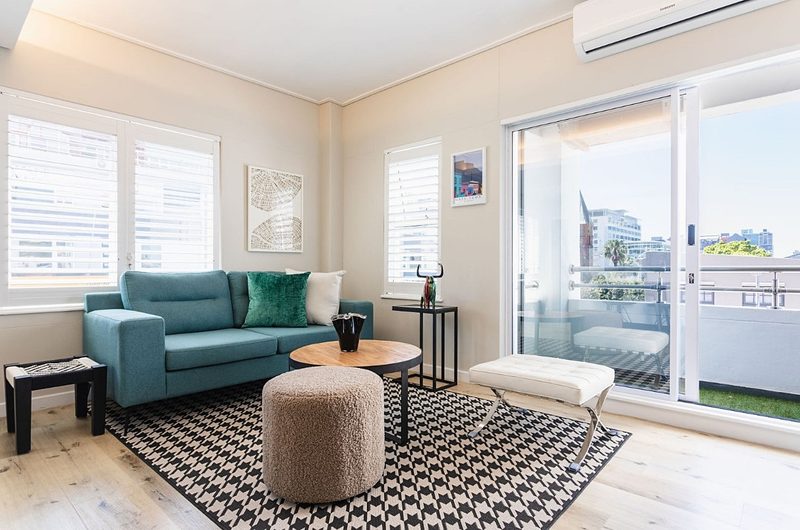 The living room at Two Twenty Loop, looking towards the balcony