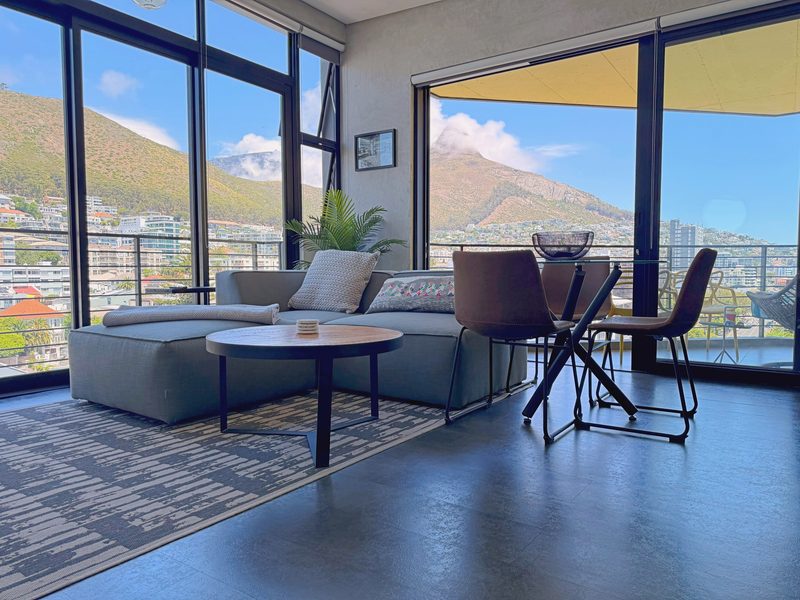 The living room at One26 on M, with the mountain through the glass