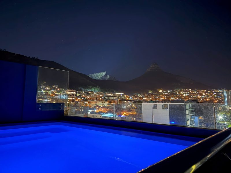 The shared rooftop pool at One26 on M in the evening